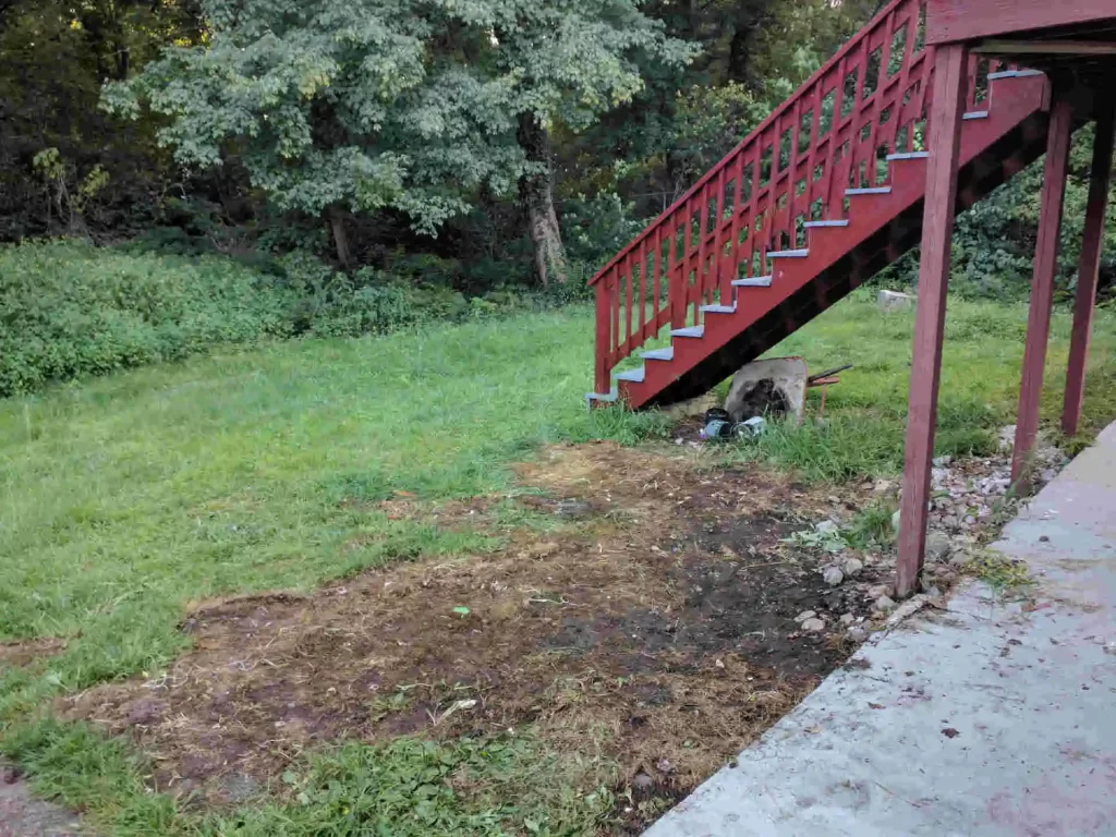 Before and after view of driveway junk removal by Ryan’s Junk Truck, clearing old furniture and debris to create a clean space in Rehoboth, MA.
